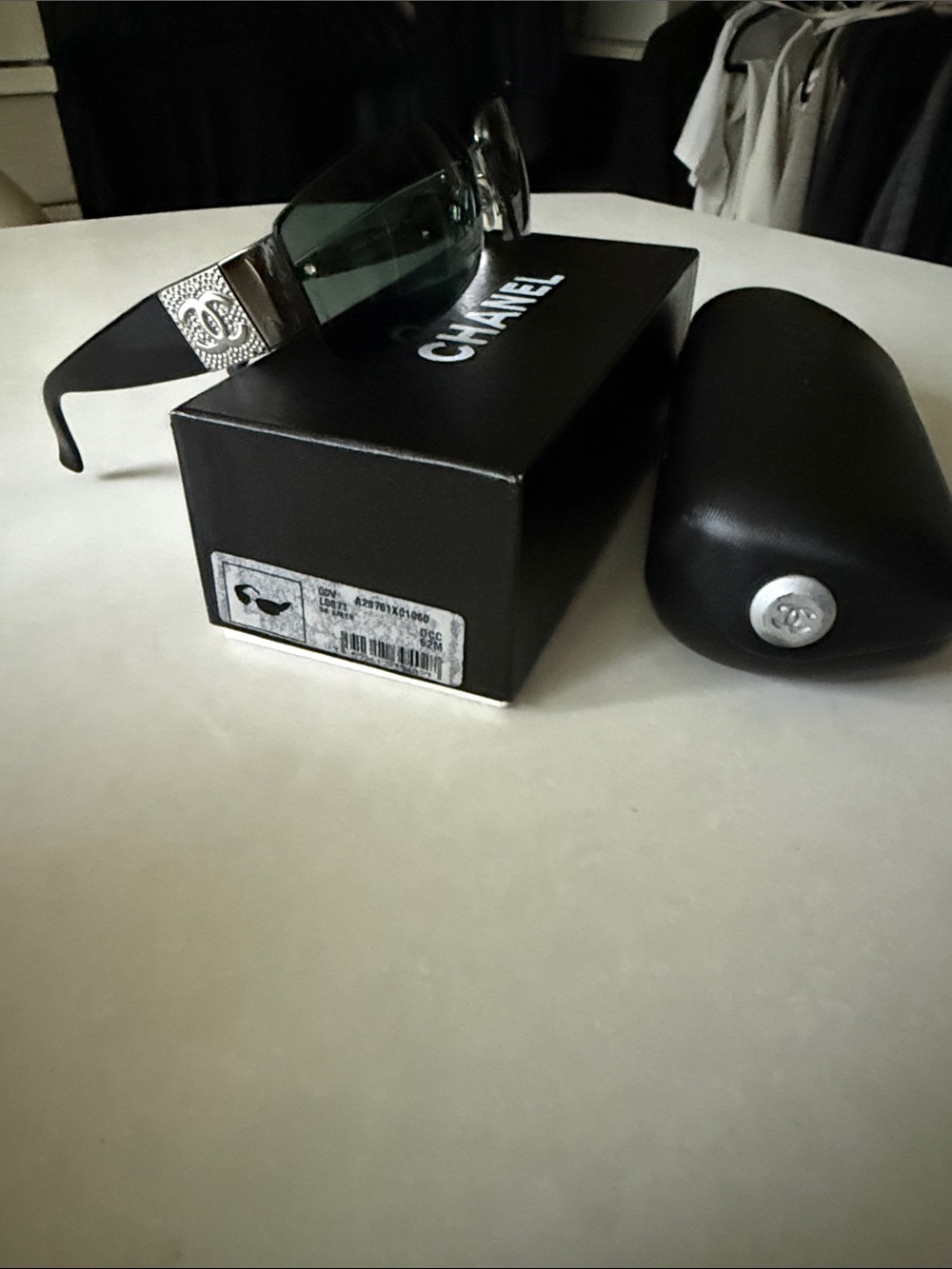CHANEL Black Frame Sunglasses with Green Lenses and CC Temple Detail